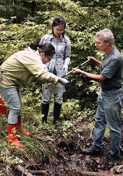 professor and students testing water