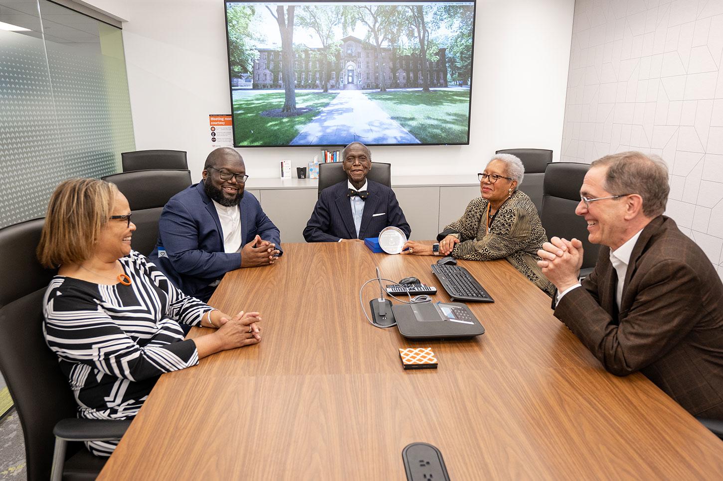 From left, Dean Richardson '93, Daniel Sherrod Evans, David L. Evans *66, Mercedes Sherrod Evans, and President Eisgruber '83