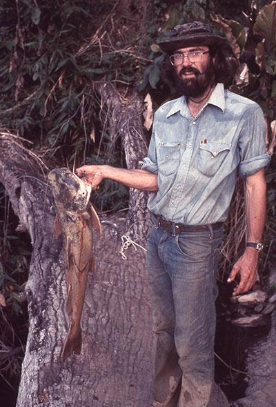 John Fitzpatrick holds a large fish in one hand