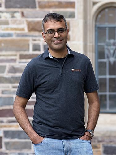 Graduate alumni Raghuveer Vinukollu in front of Nassau Hall